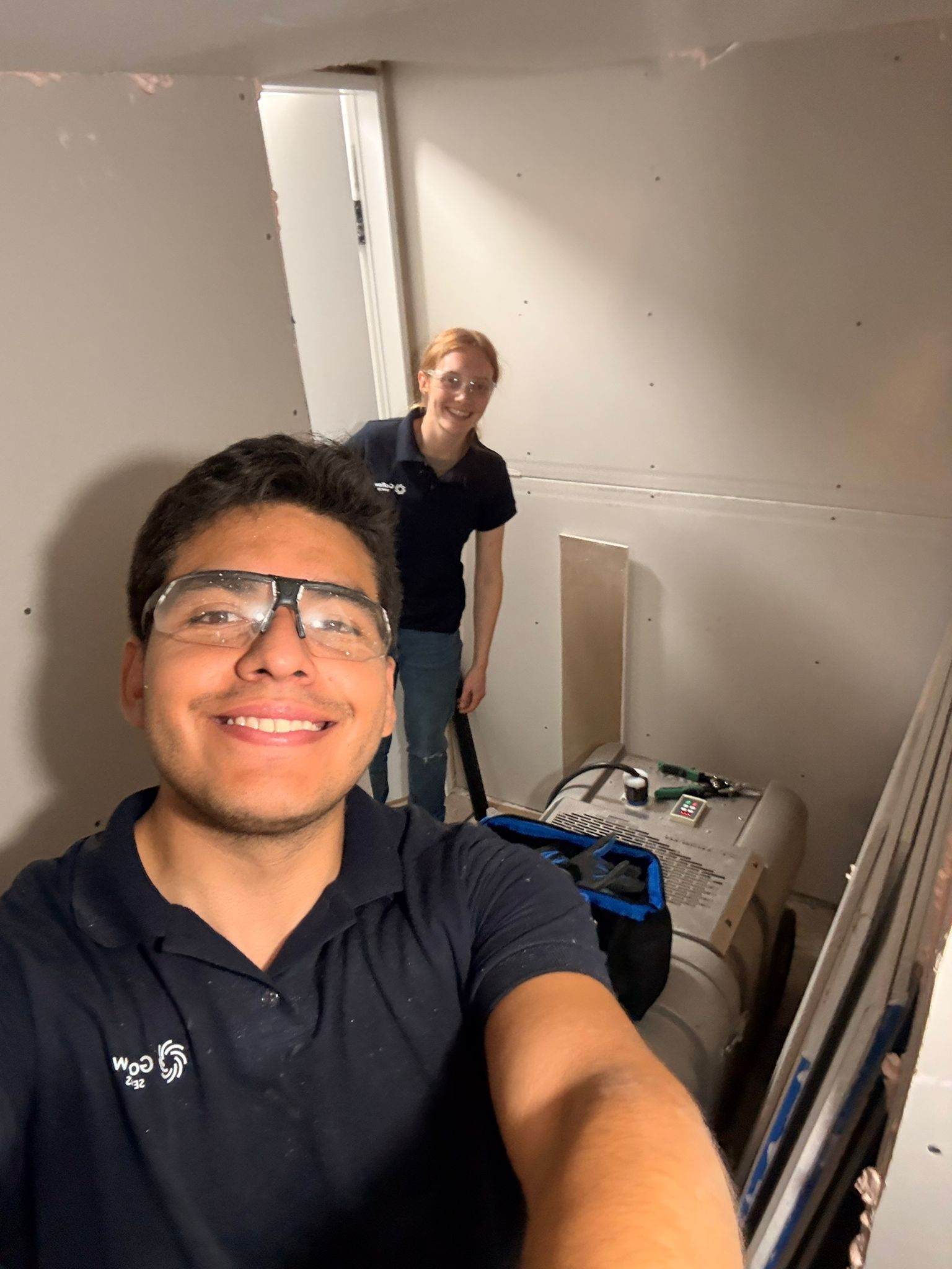 A happy family sitting on a couch in a clean home